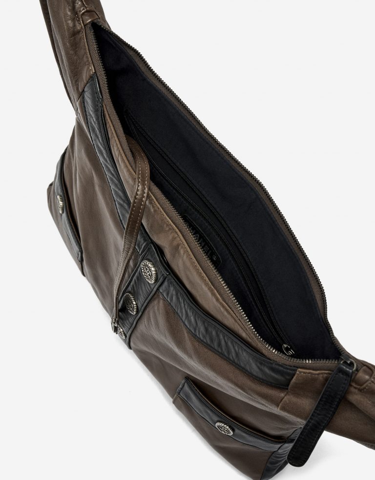 Inside of a pre-loved Chanel Girl Medium Lambskin in Brown and Black on SACLÀB