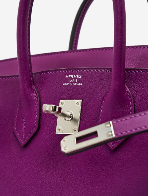 Hardware details of a pre-loved Hermès Birkin 25 Swift Anemone on SACLÀB