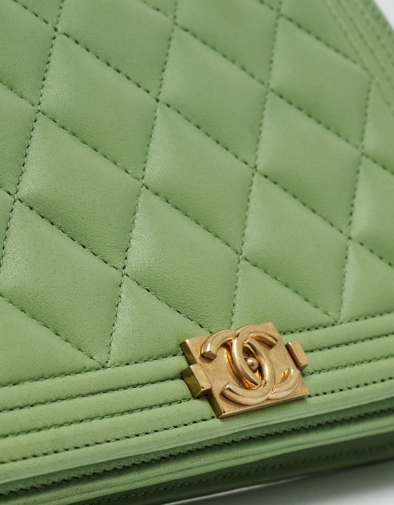 Gold Chanel Hardware Detail of a pre-loved Chanel Boy Wallet on Chain Lambskin in Light Green on SACLÀB