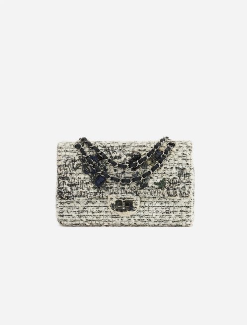 A pre-loved Chanel 2.55 Reissue 226 Tweed White Black Garden Charms on SACLÀB
