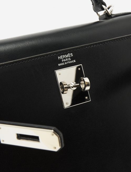 A pre-loved Hermès Kelly 32 Box Leather in Black on SACLÀB