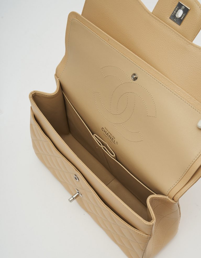 A pre-loved Chanel Timeless Jumbo Caviar Beige on SACLÀB