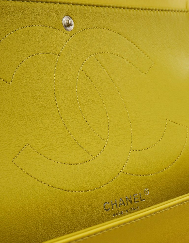 A pre-loved Chanel 2.55 Reissue 227 Patent Caviar Yellow on SACLÀB