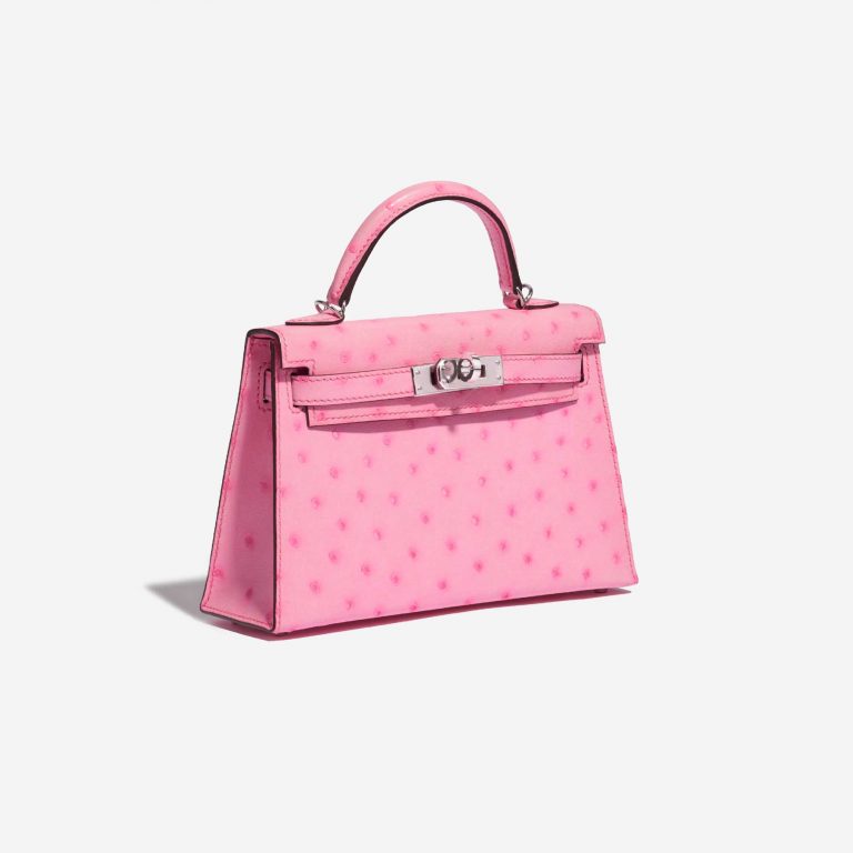 Pre-owned Hermès bag Hermes Kelly Mini 5P Bubblegum Ostrich Pink Side Front | Sell your designer bag on Saclab.com