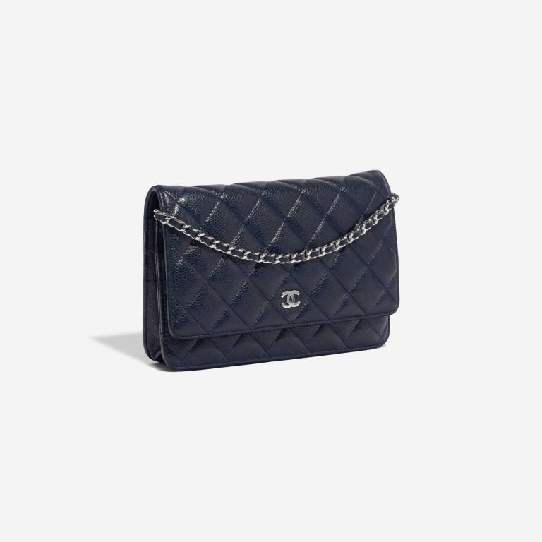 Pre-owned Chanel bag Timeless WOC Caviar Dark Blue Blue Side Front | Sell your designer bag on Saclab.com