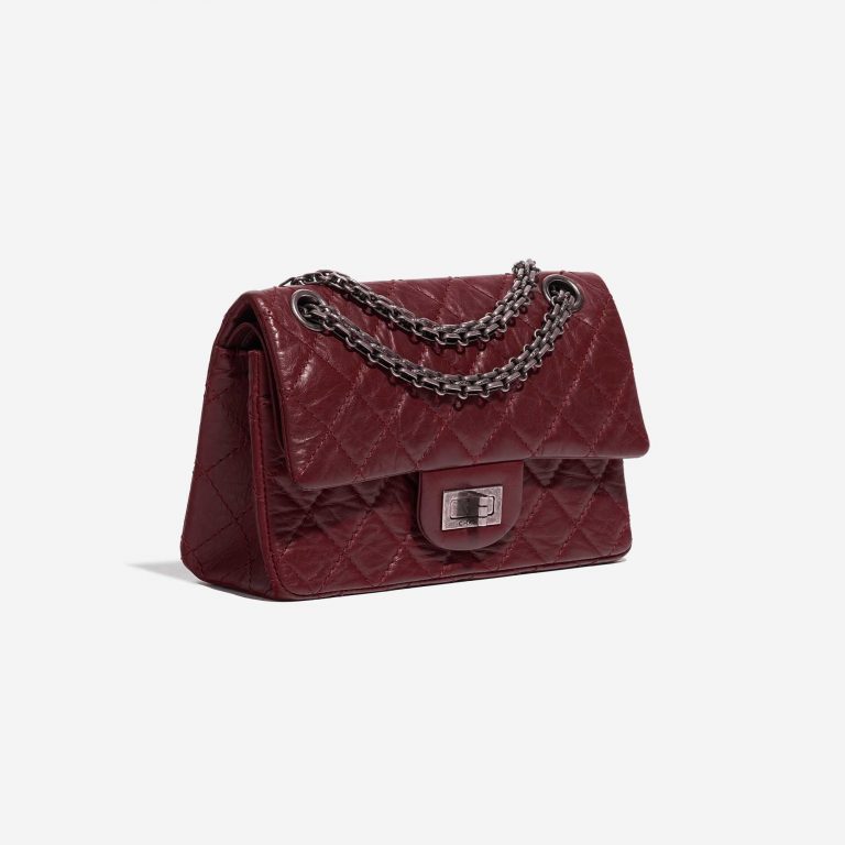 Pre-owned Chanel bag 2.55 Reissue 224 Lamb Dark Red Red Side Front | Sell your designer bag on Saclab.com