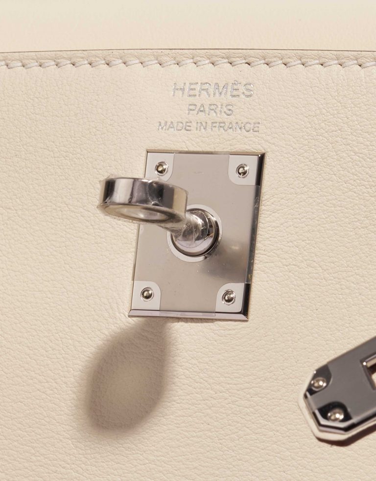 Pre-owned Hermès bag Kelly 25 Swift Nata In & Out Beige, White Logo | Sell your designer bag on Saclab.com