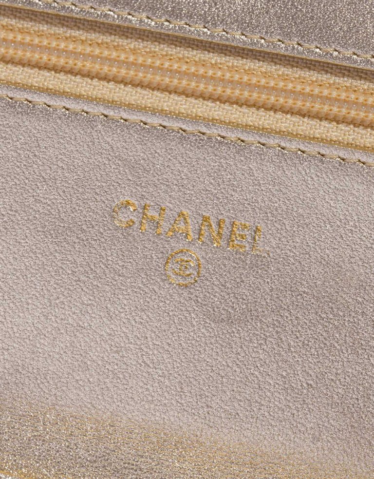 Pre-owned Chanel bag Timeless WOC Silk / Metallic Lambskin Black / Gold Black Logo | Sell your designer bag on Saclab.com