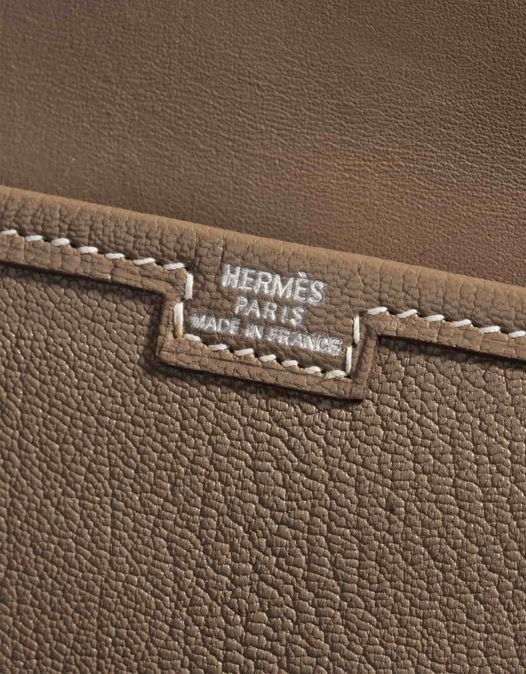 Pre-owned Hermès bag Jige Clutch Mini Chevre Etoupe Brown Logo | Sell your designer bag on Saclab.com