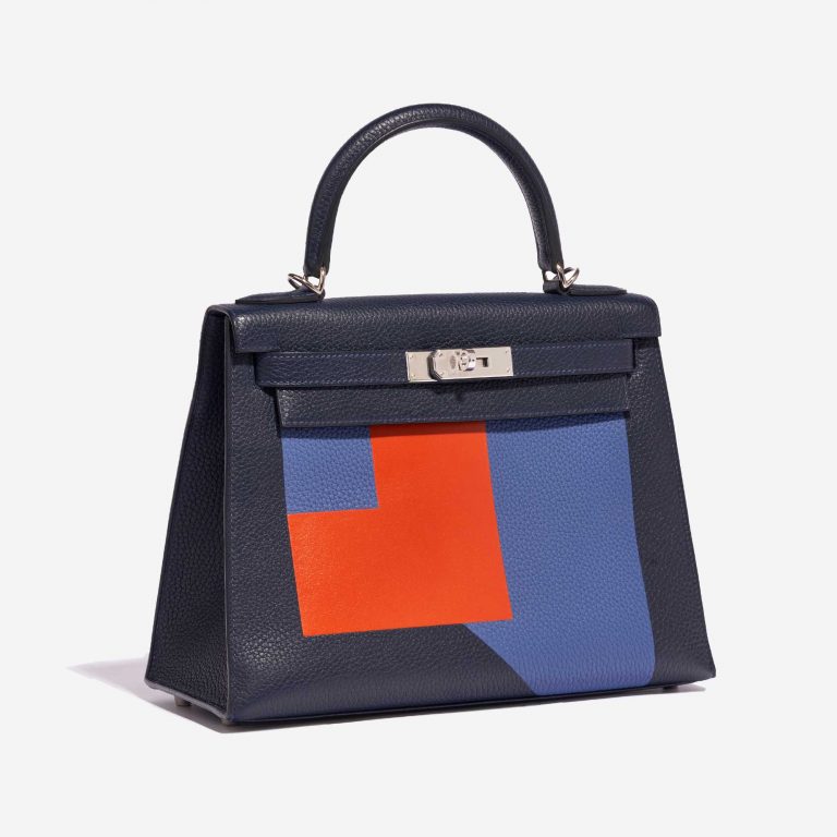 Pre-owned Hermès bag Kelly 28 Lettre R Clemence / Tadelakt Blue Nuit / Blue Brighton / Terre Battue Blue, Multicolour Side Front | Sell your designer bag on Saclab.com