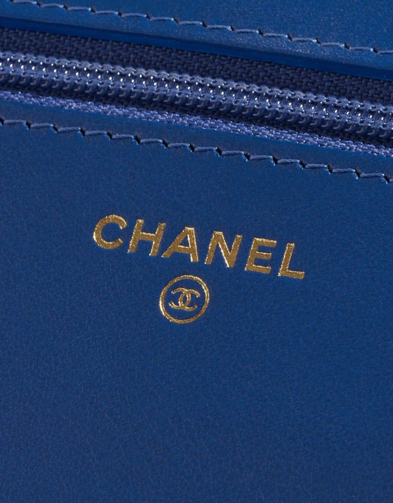 Pre-owned Chanel bag WOC Camellia Lamb Blue Blue Logo | Sell your designer bag on Saclab.com
