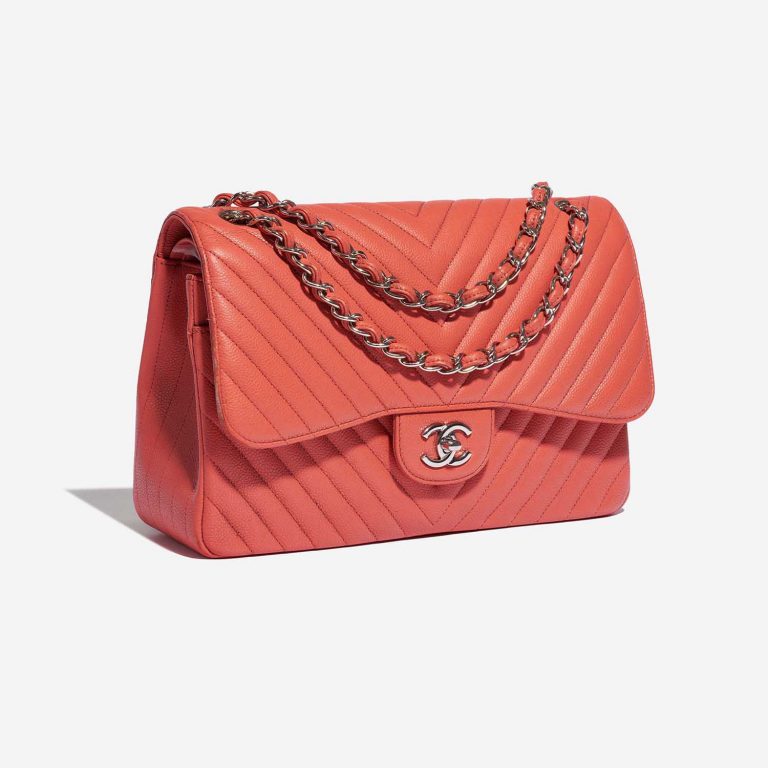 Pre-owned Chanel bag Timeless Jumbo Caviar Coral Pink Pink Side Front | Sell your designer bag on Saclab.com