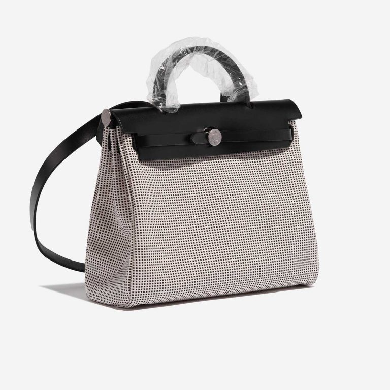 Pre-owned Hermès bag Herbag 31 Toile Quadrille Viking / Vache Hunter Ecru / Black / White Black, White Side Front | Sell your designer bag on Saclab.com