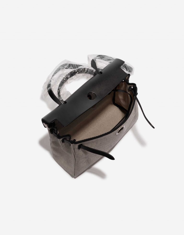 Pre-owned Hermès bag Herbag 31 Toile Quadrille Viking / Vache Hunter Ecru / Black / White Black, White Inside | Sell your designer bag on Saclab.com