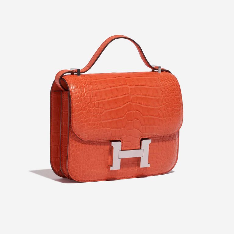 Pre-owned Hermès bag Constance 18 Matte Alligator Orange Poppy Orange Side Front | Sell your designer bag on Saclab.com