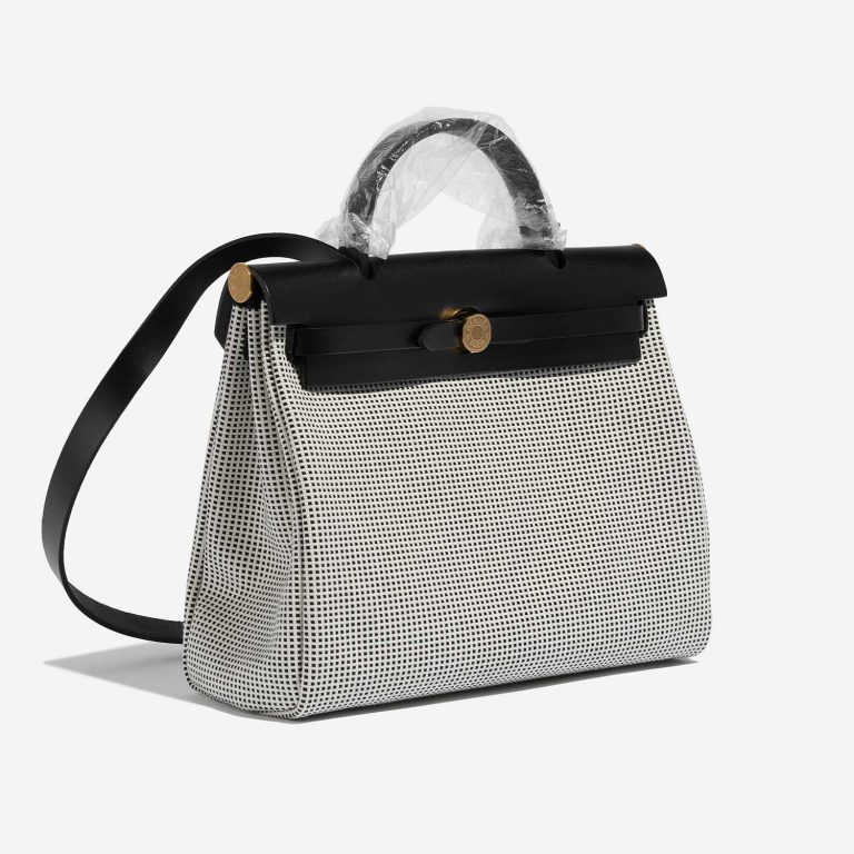 Pre-owned Hermès bag Herbag 31 Vache Hunter / Toile Quadrille Viking Black / White / Ecru Black, White Side Front | Sell your designer bag on Saclab.com