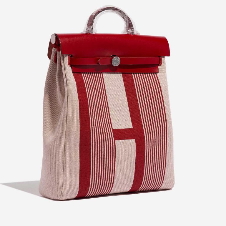 Pre-owned Hermès bag Herbag Backpack Vache Hunter / Toile Bordeaux / Ecru / Beige / Piment Beige, Red Side Front | Sell your designer bag on Saclab.com
