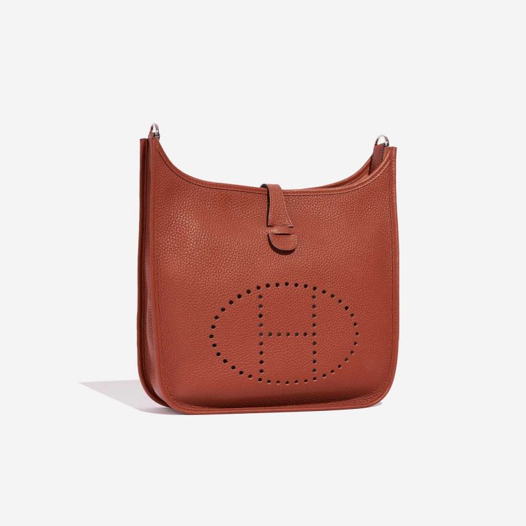 Pre-owned Hermès bag Evelyne 29 Taurillon Clemence Cuivre Orange Side Front | Sell your designer bag on Saclab.com