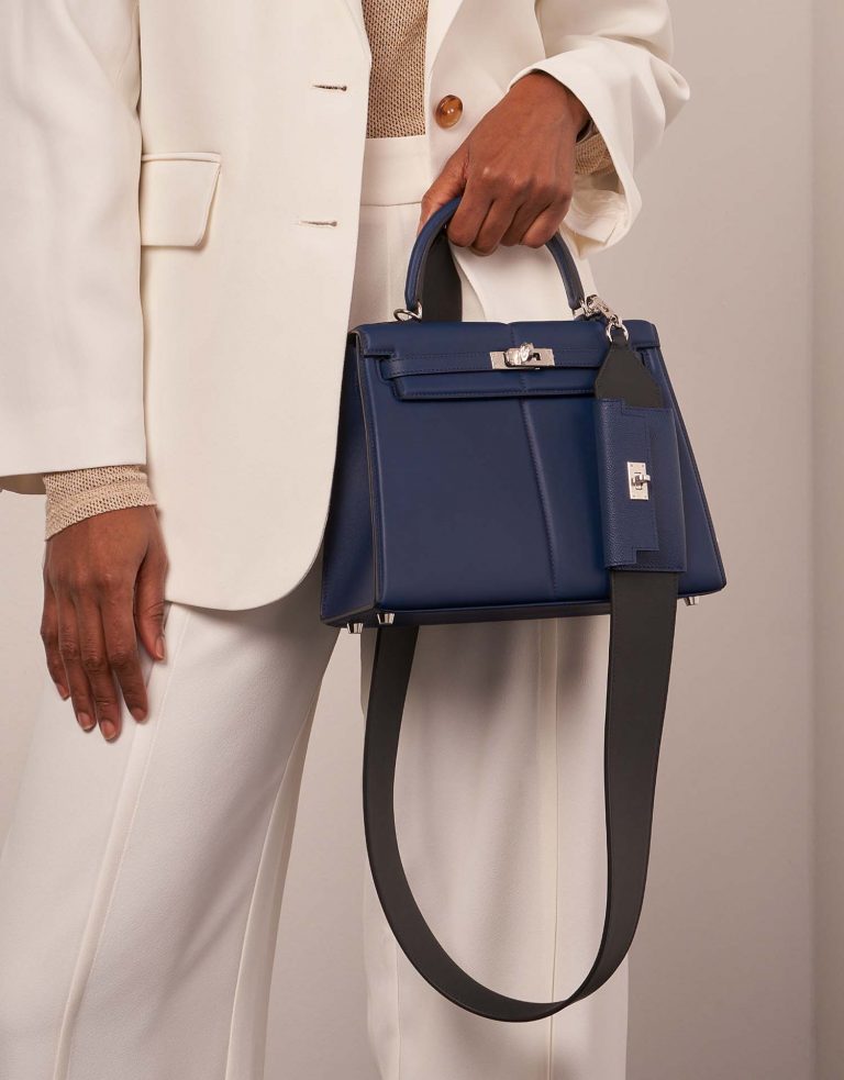 Hermès KellyPocketStrap Caban-BleuSaphir Sizes Worn | Sell your designer bag on Saclab.com