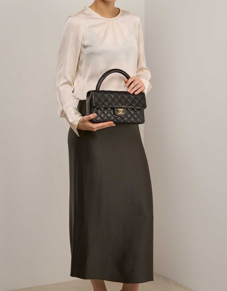 Chanel TimelessHandle Medium Black on Model | Sell your designer bag on Saclab.com