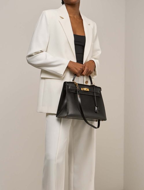 Hermès Kelly 32 Box Black on Model | Sell your designer bag