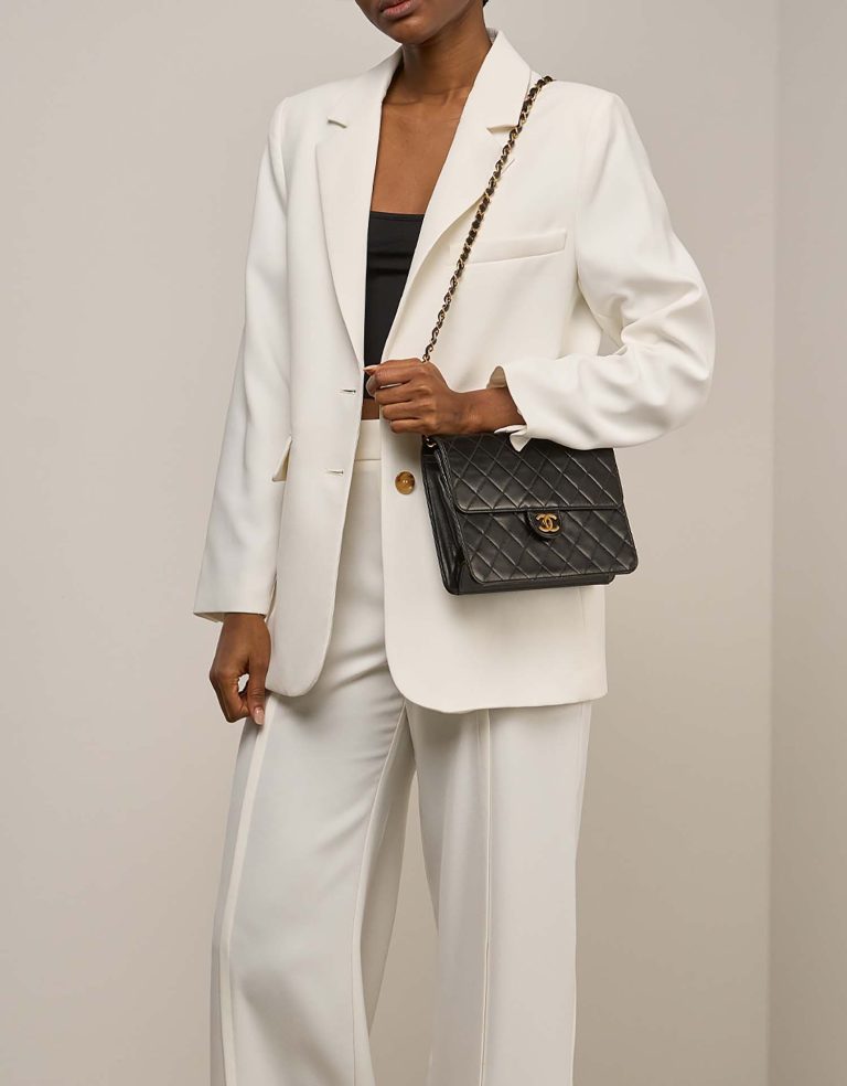 Chanel Flap Bag New Small Lamb Black on Model | Sell your designer bag