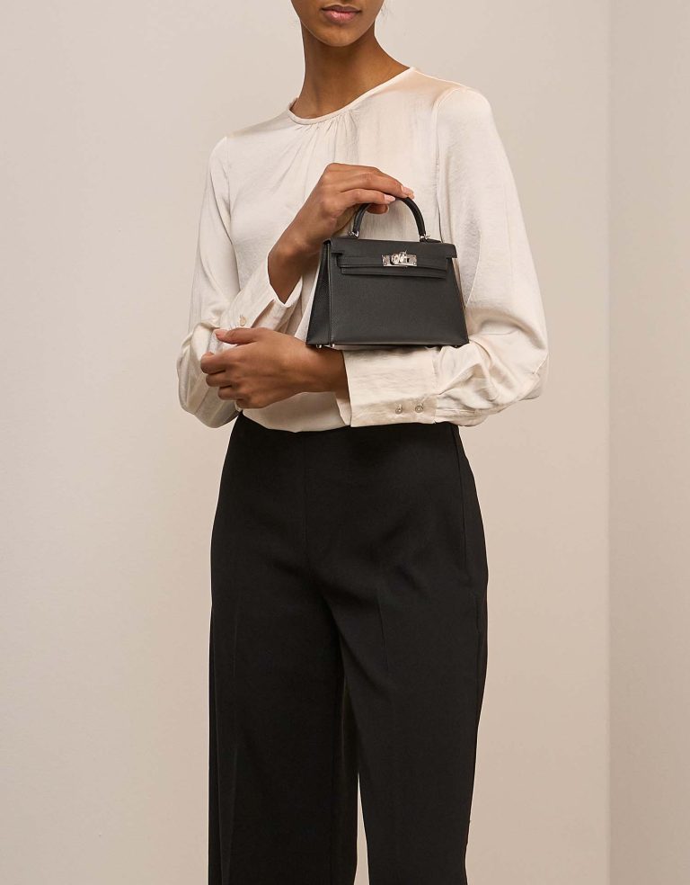 Hermès Kelly Mini Epsom Black on Model | Sell your designer bag