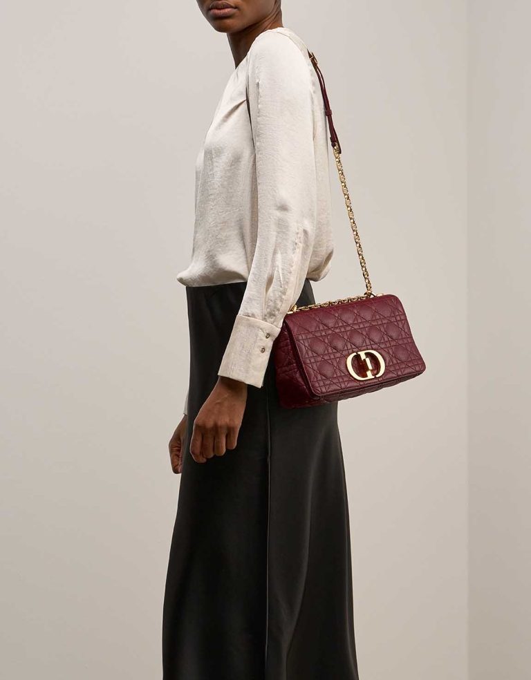 Dior Caro Medium Calf Dark Red on Model | Sell your designer bag