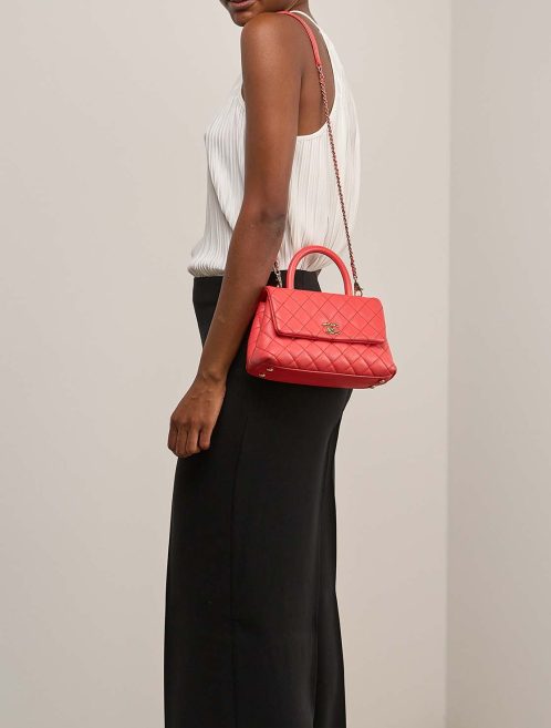 Chanel Timeless Handle Small Caviar Coral on Model | Sell your designer bag