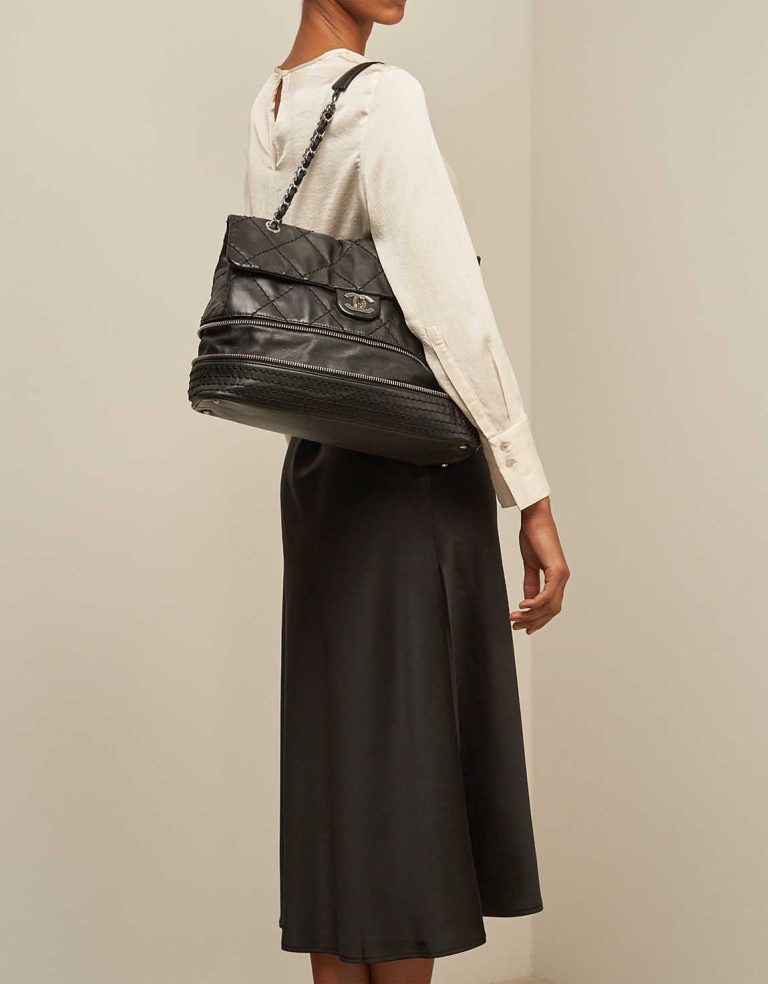 Chanel Timeless Flap Bag Maxi Lamb Black on Model | Sell your designer bag