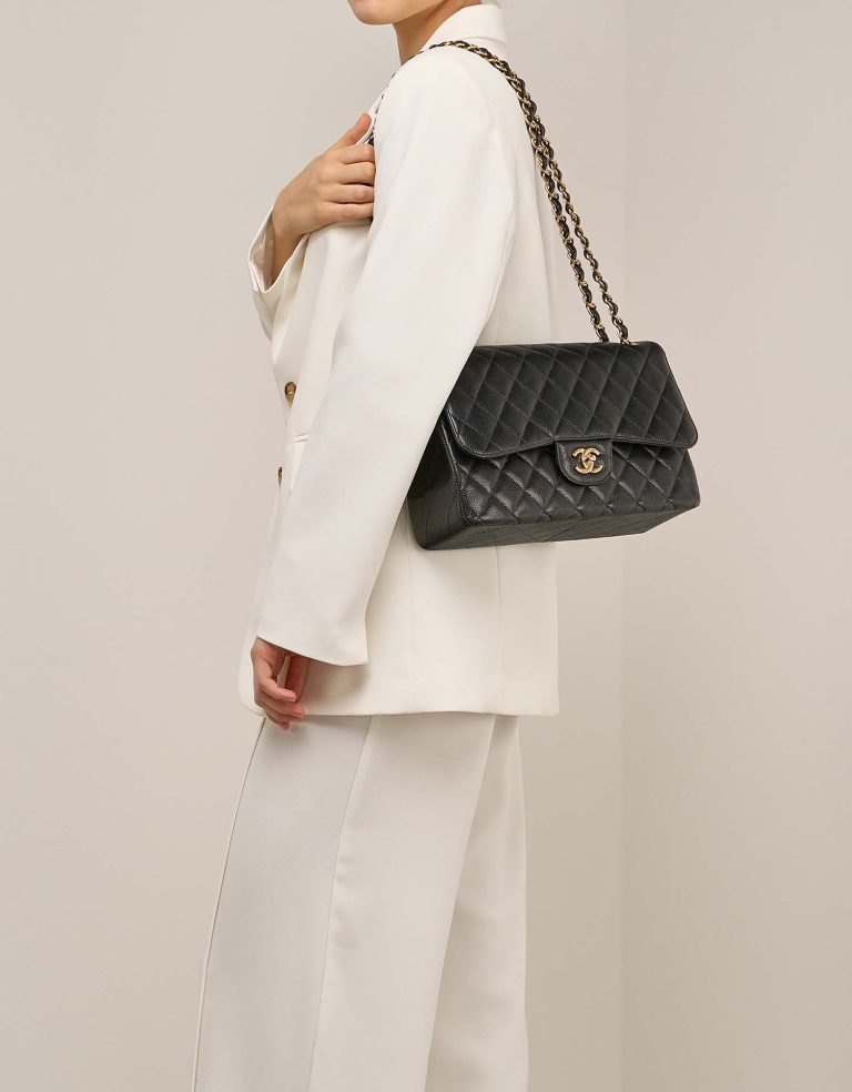 Chanel Timeless Jumbo Caviar Black on Model | Sell your designer bag