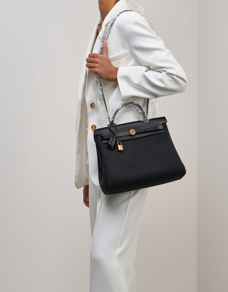 Hermès Herbag 31 Toile / Vache Hunter Black on Model | Sell your designer bag