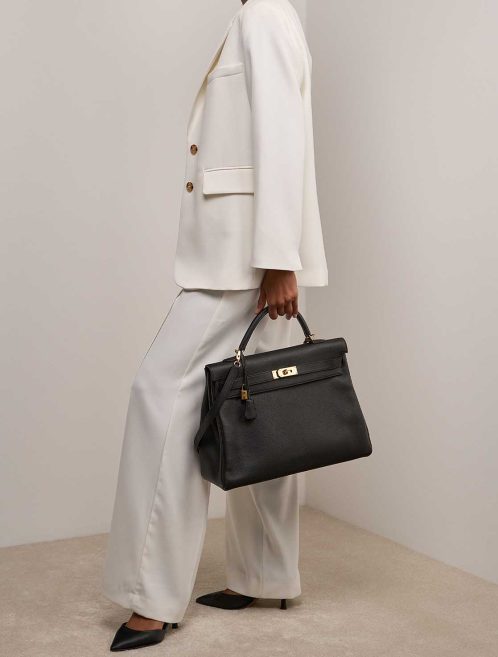 Hermès Kelly 40 Togo Black on Model | Sell your designer bag