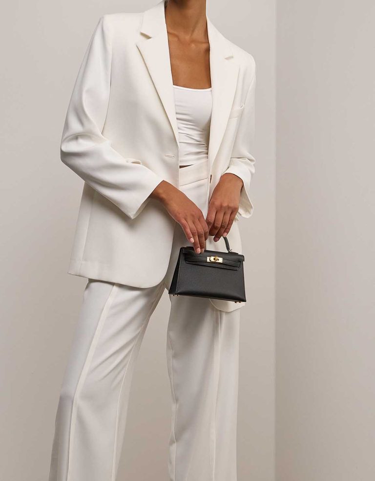 Hermès Kelly Mini Epsom Black on Model | Sell your designer bag