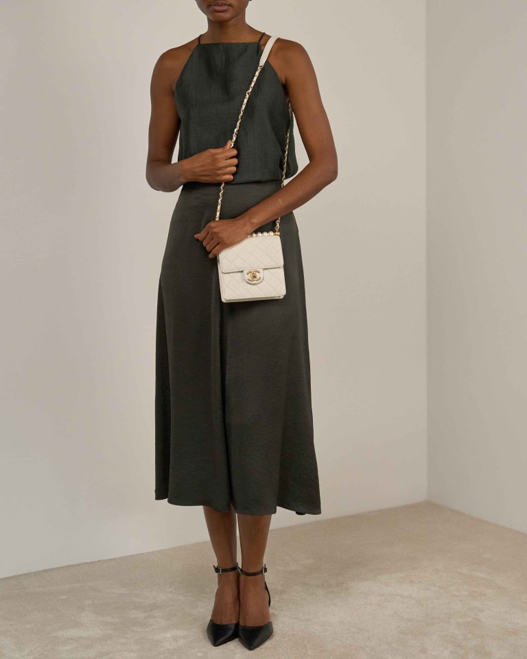 Chanel Timeless Mini Square Lamb Pearl White on Model | Sell your designer bag