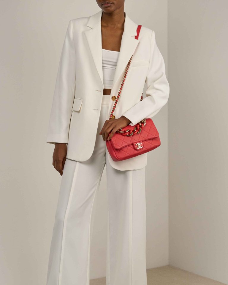 Chanel Timeless Medium Lamb Coral Red on Model | Sell your designer bag