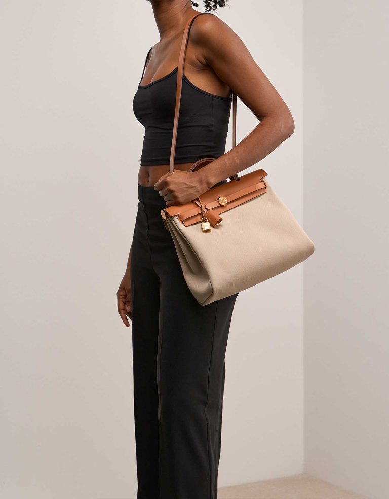 Hermès Herbag 31 Toile Militaire / Vache Hunter Béton / Naturel on Model | Sell your designer bag
