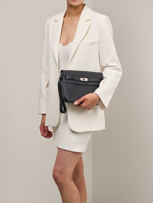 Hermès Kelly Dépêches Pouch 25 Togo Caban on Model | Sell your designer bag