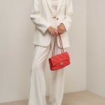 Chanel Timeless Medium Lamb Orange on Model | Sell your designer bag