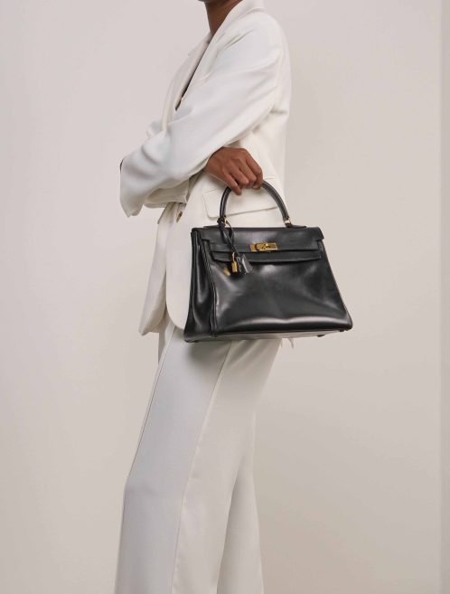 Hermès Kelly 32 Box Black on Model | Sell your designer bag