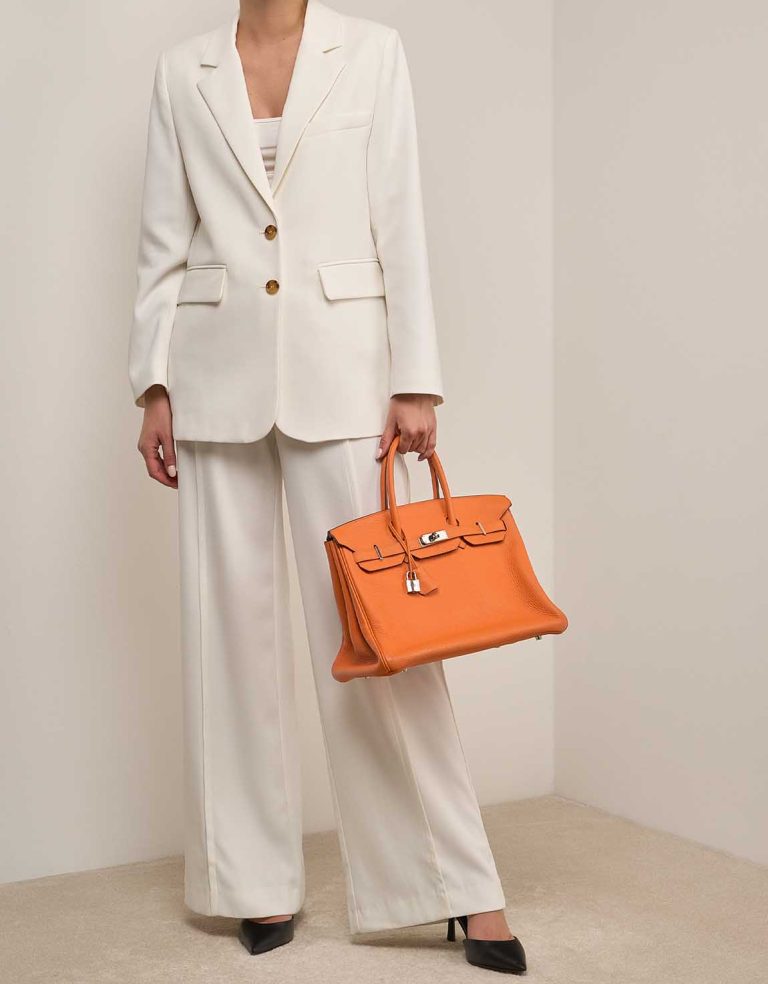 Hermès Birkin 35 Orange Clémence on Model | Sell your designer bag