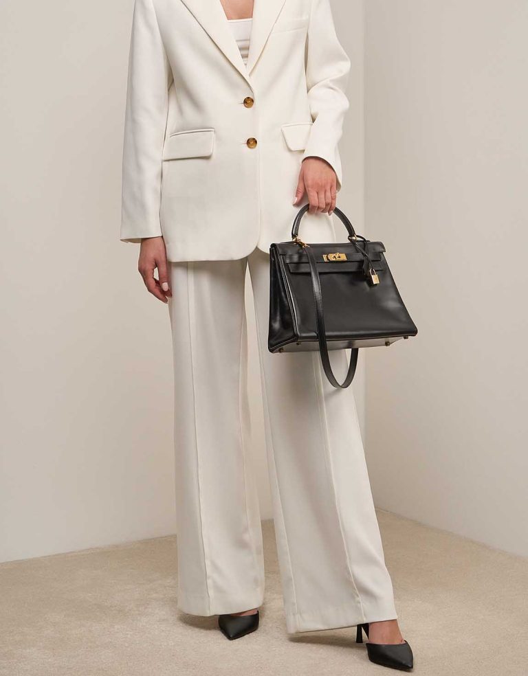Hermès Kelly 32 Box Calf Black on Model | Sell your designer bag