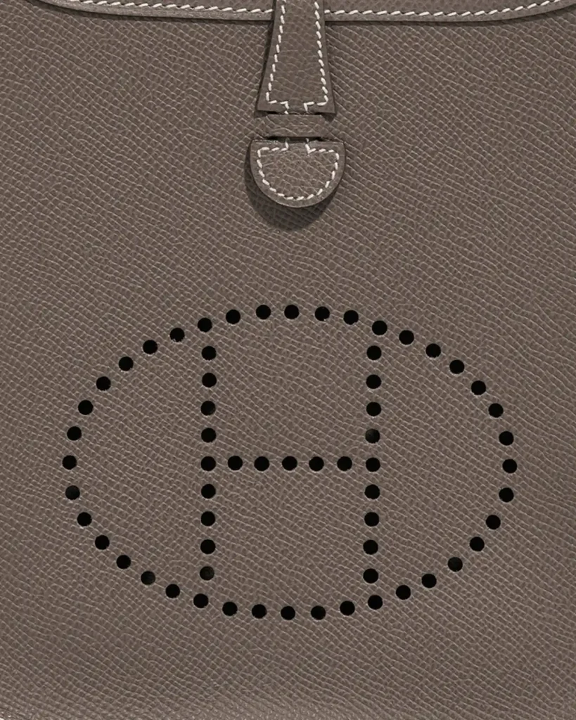 Details of perforated H on a Mini Evelyne in Etoupe, sold on saclab.com