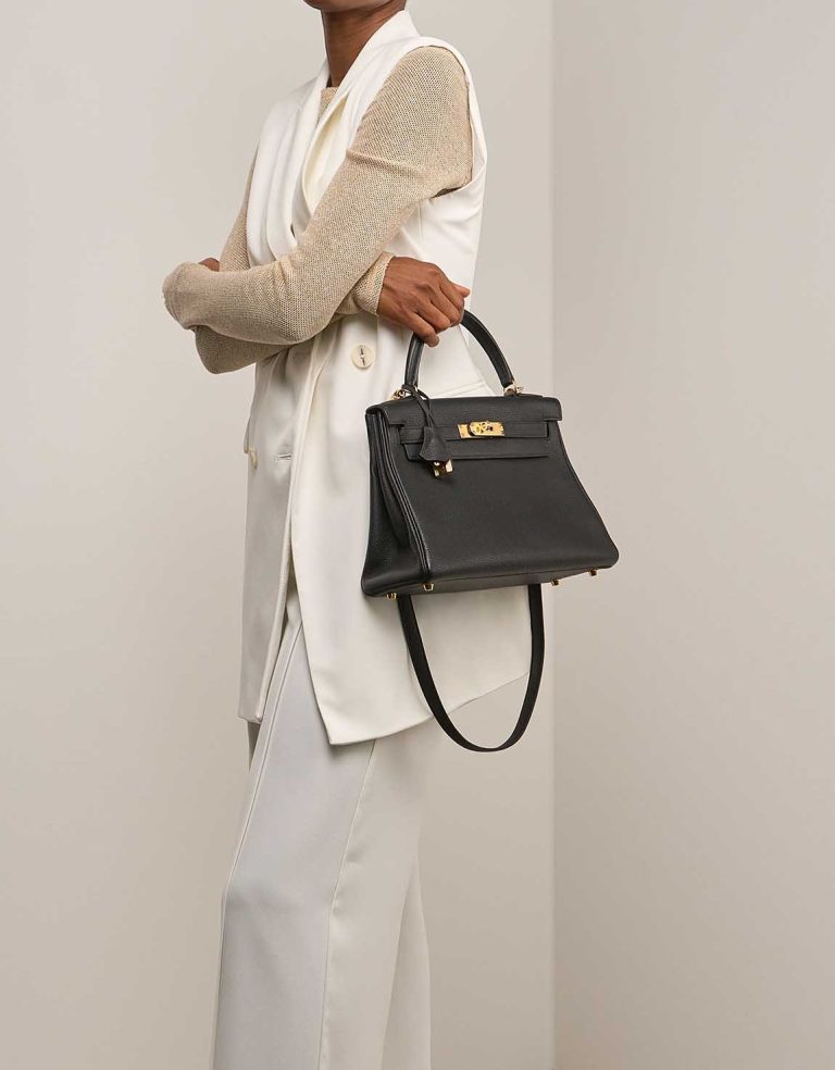 Hermès Kelly 28 Togo Black on Model | Sell your designer bag