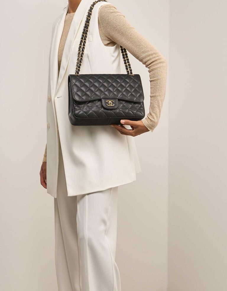 Chanel Timeless Jumbo Caviar Black on Model | Sell your designer bag