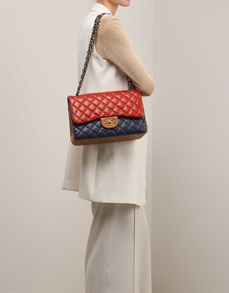 Chanel Timeless Jumbo Lamb Blue / Red / Brown on Model | Sell your designer bag