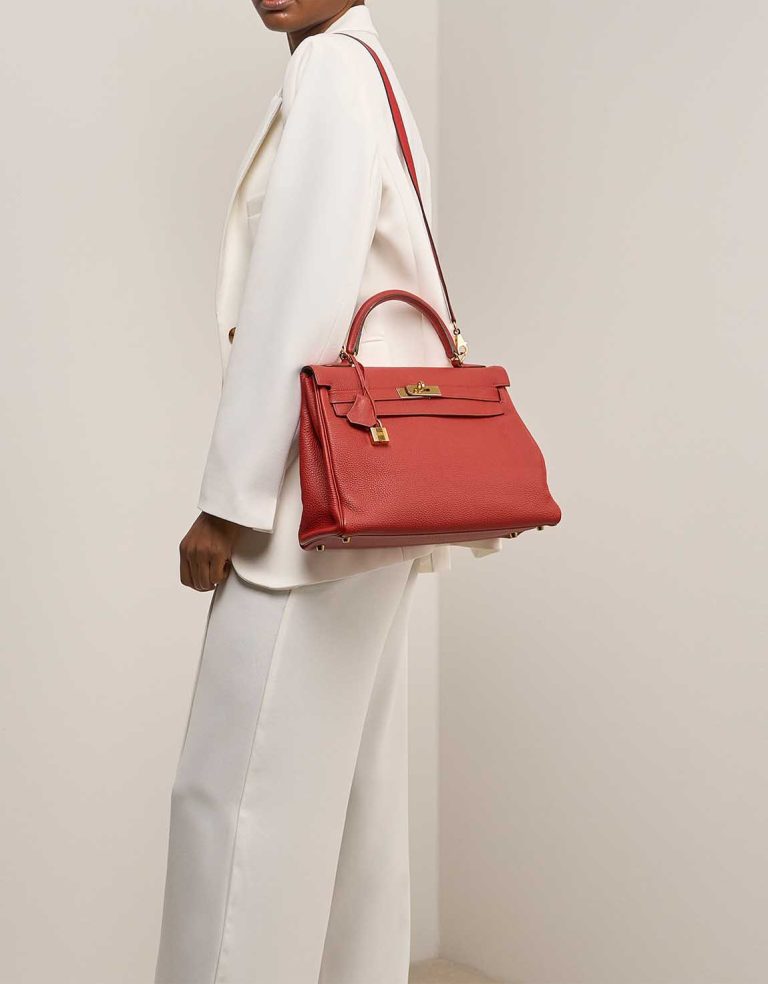 Hermès Kelly 32 Togo Rouge de Coeur on Model | Sell your designer bag
