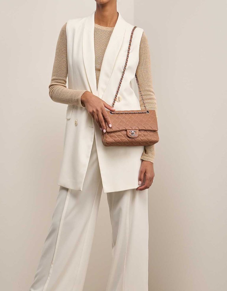 Chanel Timeless Medium Caviar Brown on Model | Sell your designer bag