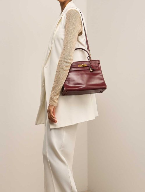 Hermès Kelly 28 Box Calf Rouge H on Model | Sell your designer bag