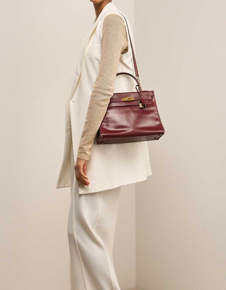 Hermès Kelly 28 Box Calf Rouge H on Model | Sell your designer bag